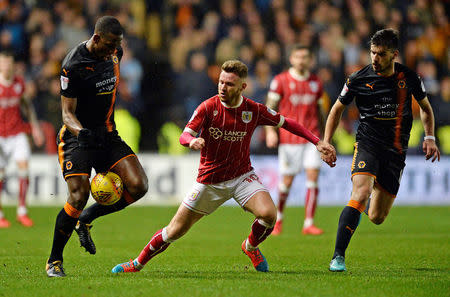 Soccer Football - Championship - Bristol City vs Wolverhampton Wanderers - Ashton Gate Stadium, Bristol, Britain - December 30, 2017 Wolves' Willy Boly and Ruben Neves in action with Bristol City's Matty Taylor Action Images/Alan Walter