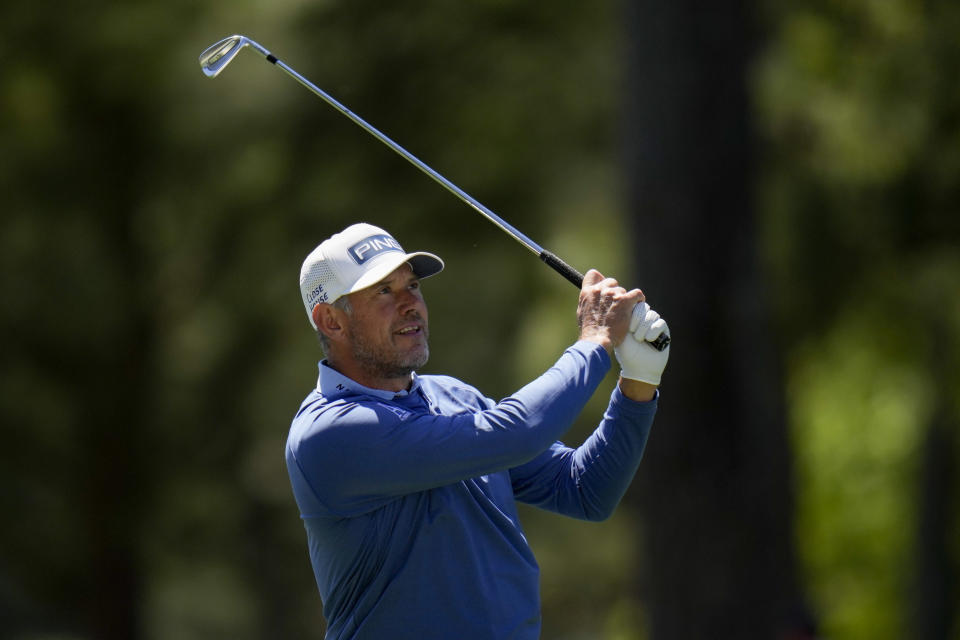 Lee Westwood, of England, watches his shot on the first fairway during the final round at the Masters golf tournament on Sunday, April 10, 2022, in Augusta, Ga. (AP Photo/Jae C. Hong)