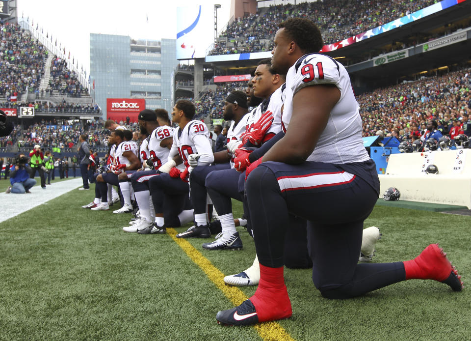 Texans player Carlos Watkins is pictured kneeling with his teammates on Sunday.&nbsp; (Photo: Jonathan Ferrey via Getty Images)