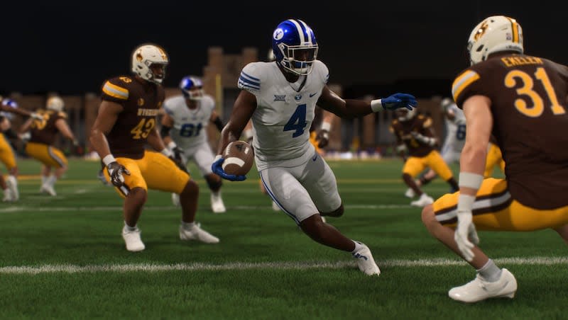 BYU running back Miles Davis runs with the ball during a simulated game between BYU and Wyoming in the EA Sports College Football 25 video game.