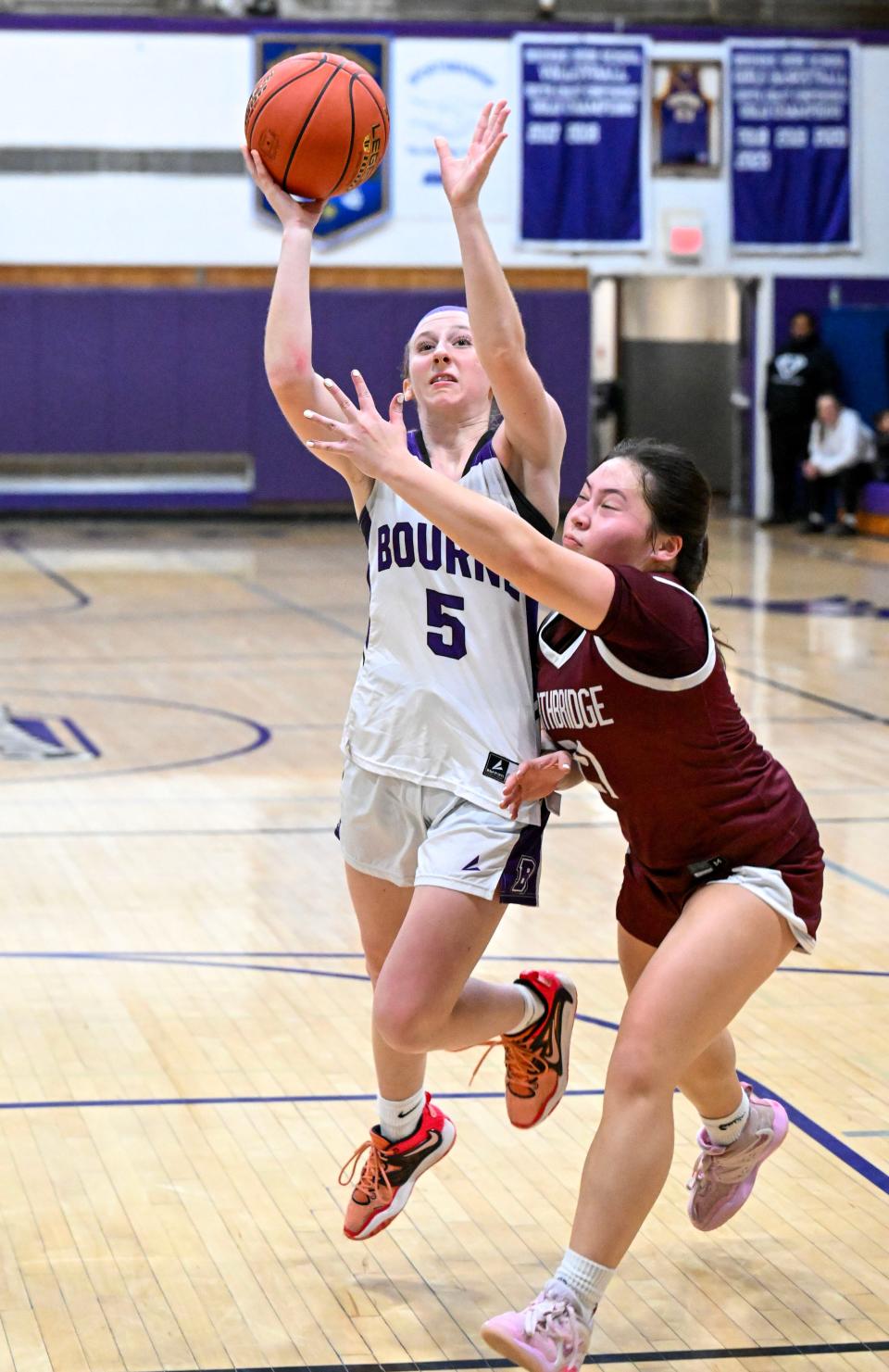 Paige Meda of Bourne goes in to score against Erika Dresp of Northbridge in the Division 2 Sweet 16 girls basketball game.