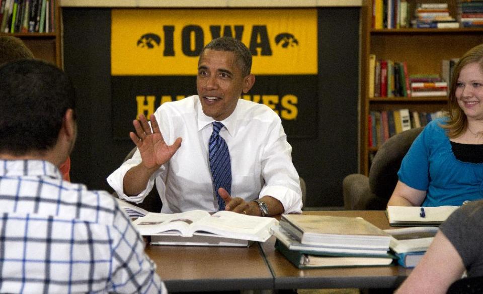 President Barack Obama participates in a roundtable discussion with students at the University of Iowa, Wednesday, April 25, 2012, in Iowa City, Iowa. at right is Myranda Burnett, and left is Martin Lopez. (AP Photo/Carolyn Kaster)