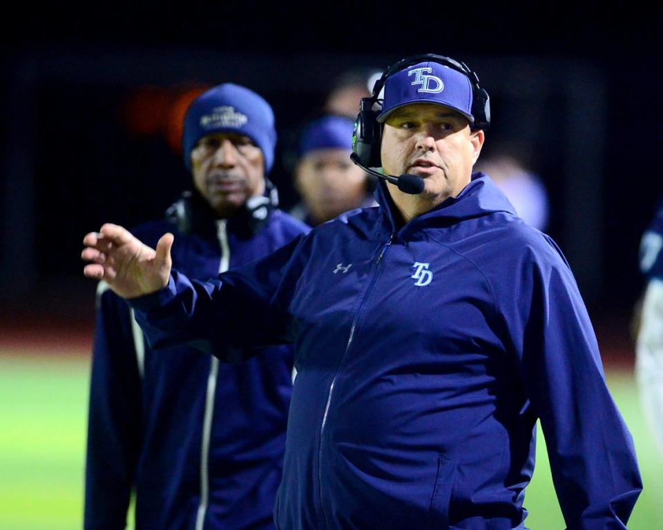 Downey Head Coach Jeremy Plaa motions to his sideline during a game between Downey and Gregori at Downey High School in Modesto California, on October 27, 2023