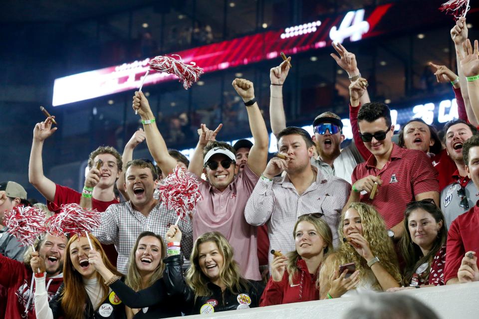 Oct 23, 2021; Tuscaloosa, Alabama, USA;  Alabama fans light up cigars to celebrate at Bryant-Denny Stadium. Alabama defeated Tennessee 52-24. Mandatory Credit: Gary Cosby Jr.-USA TODAY Sports