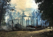 <p>Smoke rises from a burned house in Gawdu Zara village, northern Rakhine state, Myanmar Thursday, Sept. 7, 2017. Journalists saw new fires burning Thursday in the Myanmar village that had been abandoned by Rohingya Muslims, and where pages from Islamic texts were seen ripped and left on the ground. (Photo: AP) </p>