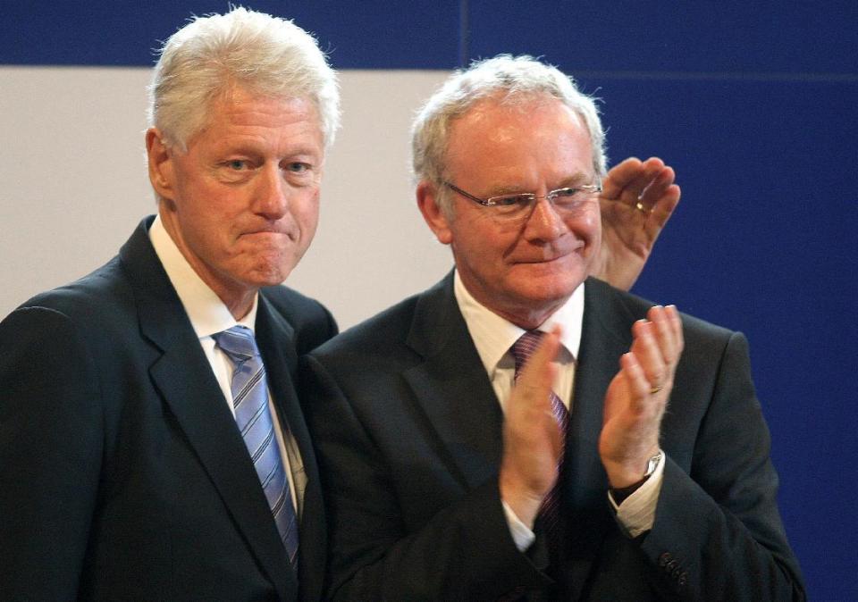 In this Sept. 29, 2010 photo, Northern Ireland's Deputy First Minister Martin McGuinness, right, is accompanied by former U.S. President Bill Clinton after speaking at the University of Ulster, Magee campus, in Londonderry. McGuinness, the Irish Republican Army warlord who led his underground, paramilitary movement toward reconciliation with Britain, and was Northern Ireland's deputy first minister for a decade in a power-sharing government, has died, his Sinn Fein party announced Tuesday, March 21, 2017, on Twitter. He was 66. (Paul Faith/PA via AP)