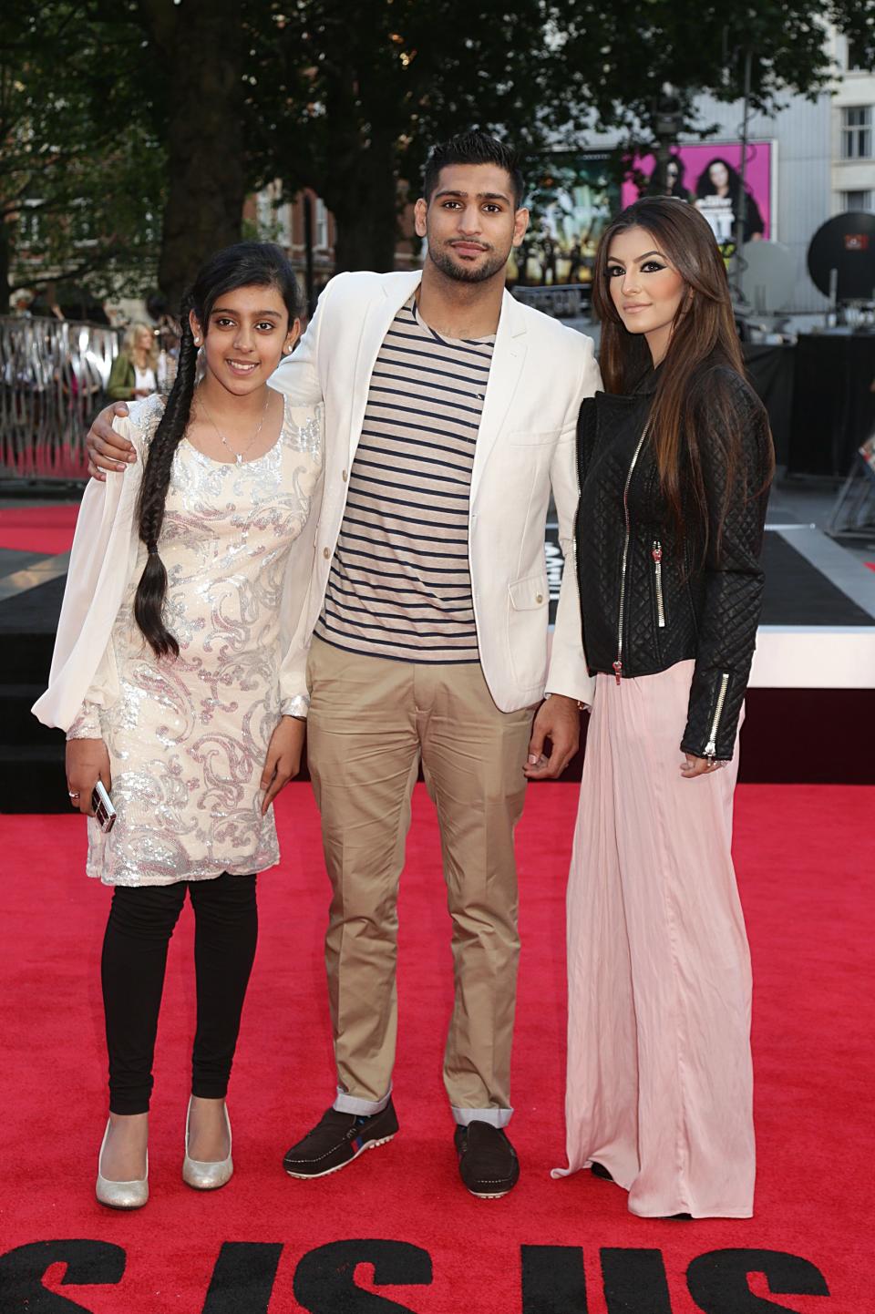 Amir Khan, (c) and Faryal Makhdoom (r) arriving for the World Premiere of One Direction: This Is Us, at the Empire Leicester Square, London.