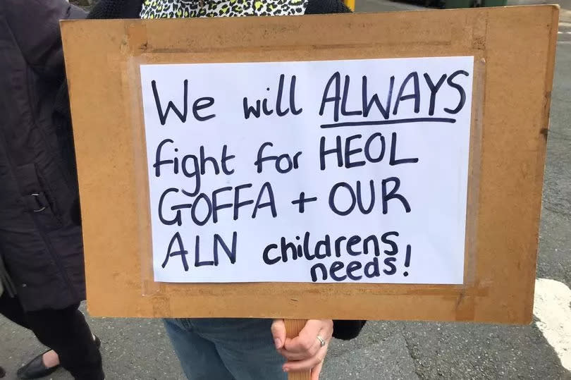 Protestors on steps outside building