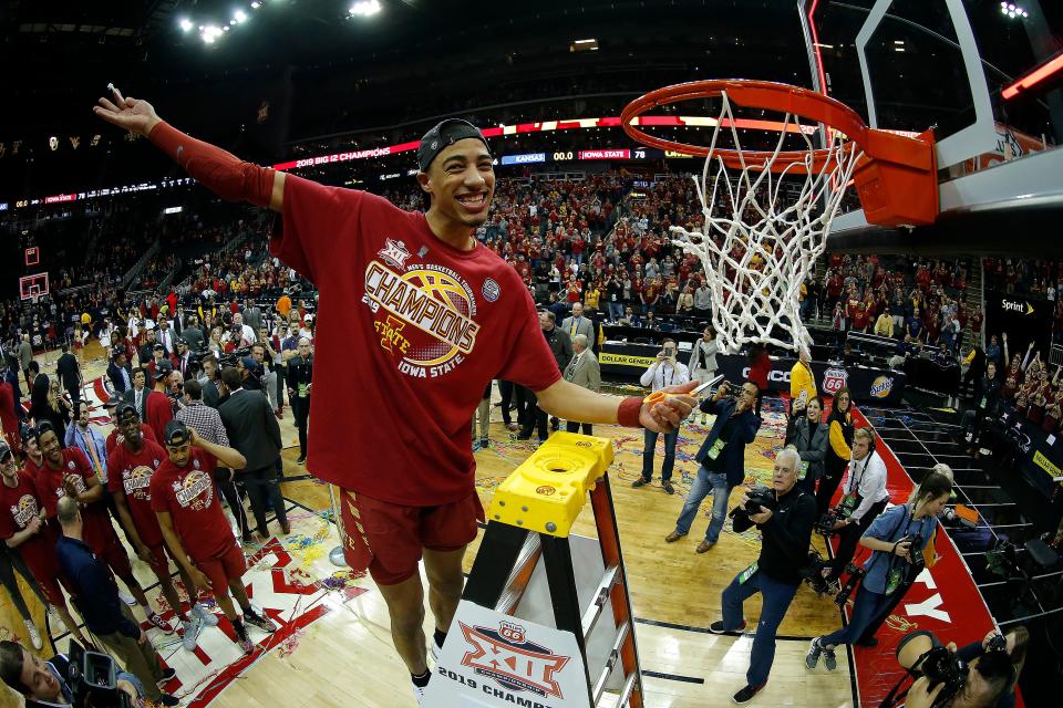 Tyrese Haliburton of the Iowa State Cyclones cuts a piece of the net after the Cyclones defeated the Kansas Jayhawks, 78-66, to win the Big 12 Basketball Tournament in 2019.