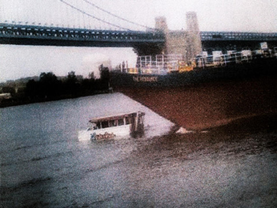 FILE - In this July 7, 2010, file photo, released by CBS3 (KYW-TV) in Philadelphia, a barge approaches a stalled duck boat on the Delaware River resulting a deadly collision in Philadelphia. Just days before a civil wrongful death lawsuit goes to federal court, attorneys for the parents of two Hungarian students killed when a barge slammed into a tour boat in Philadelphia nearly two years ago released a new video of the crash. A spokesman for the plaintiffs’ attorneys says the video, released Tuesday, May 2, 2012, shows the impact of the barge and tour boat from the Camden, N.J., side of the river. It was part of the official record compiled by the National Transportation Safety Board, which investigated the crash. (AP Photo/CBS3 KYW-TV, File) MANDATORY CREDIT; NO SALES