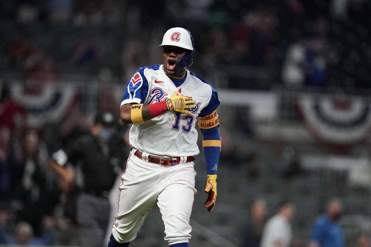 Atlanta Braves' Ronald Acuna Jr. celebrates a homer run against Miami. (AP Photo/Brynn Anderson)