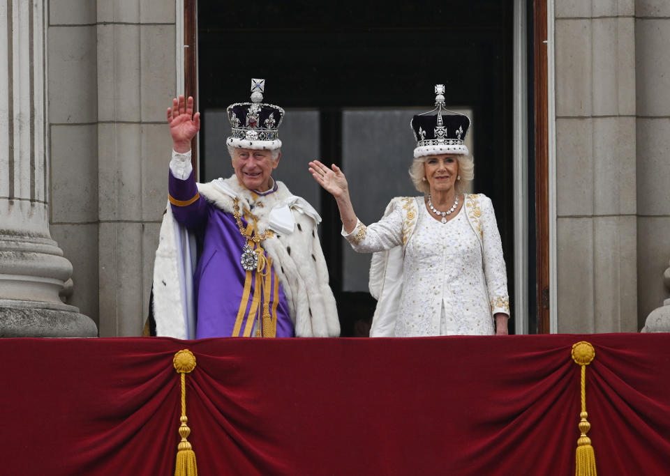 King Charles III and Queen Camilla wave from the Buckingham Palace balcony.<span class="copyright">Brandon Bell—Getty Images</span>