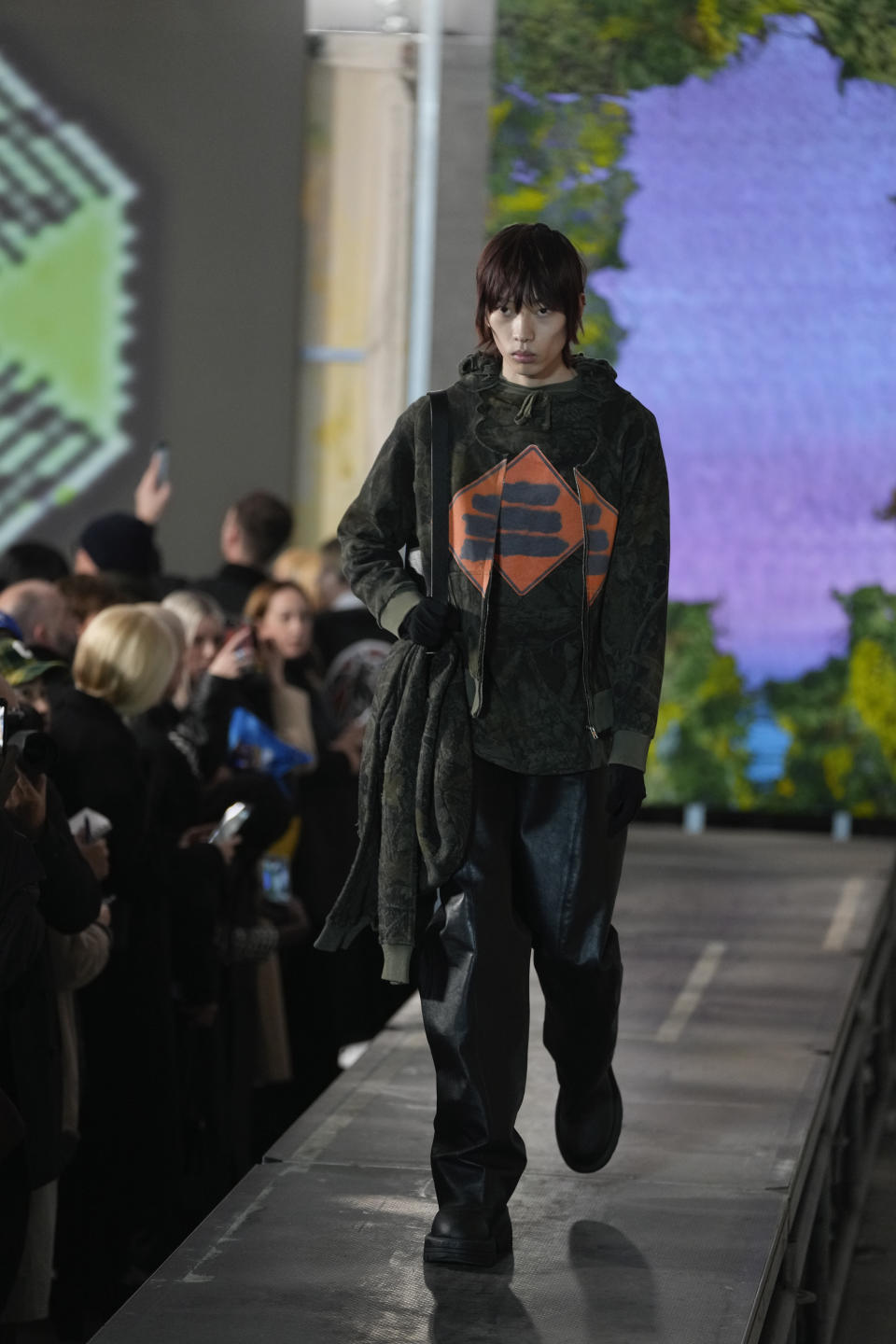 A model wears a creation as part of the ALUX9SM menswear Fall-Winter 2023-24 collection presented in Milan, Italy, Friday, Jan. 13, 2023. (AP Photo/Luca Bruno)