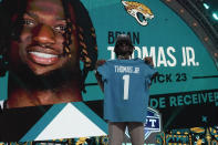 LSU wide receiver Brian Thomas Jr. poses after being chosen by the Jacksonville Jaguars with the 23rd overall pick during the first round of the NFL football draft, Thursday, April 25, 2024, in Detroit. (AP Photo/Jeff Roberson)