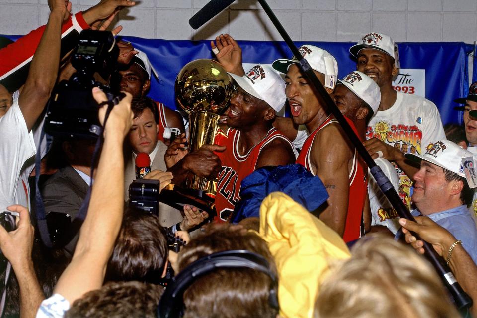 Michael Jordan and the Bulls celebrate after beating the Suns, 99-98, in Game 6 of the 1993 NBA Finals. (Getty Images)