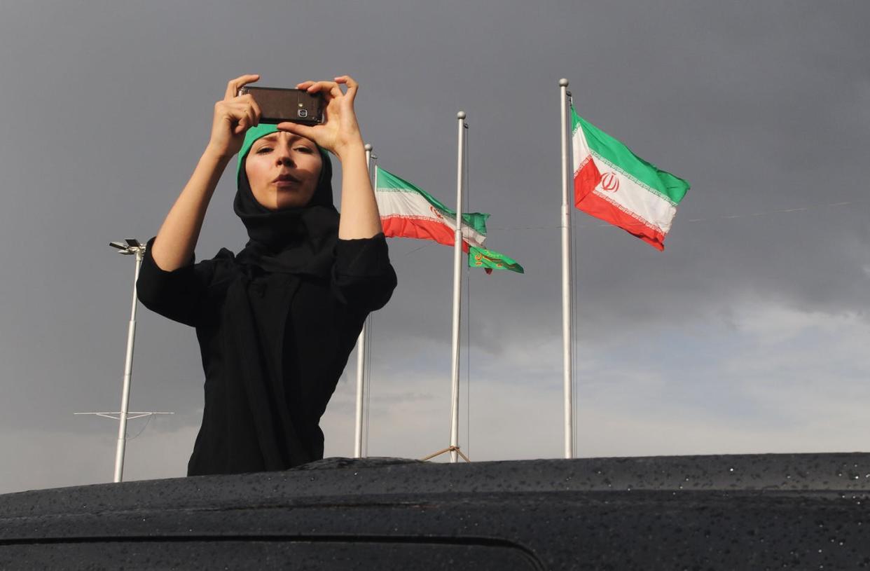 <span class="caption">A demonstrator protesting a disputed election wearing a headband in support of the Green Movement, Tehran, June 15, 2009. </span> <span class="attribution"><a class="link " href="https://www.gettyimages.com/detail/news-photo/female-demonstrator-wearing-a-green-headband-takes-a-news-photo/116256568?adppopup=true" rel="nofollow noopener" target="_blank" data-ylk="slk:Kaveh Kazemi/Getty Images;elm:context_link;itc:0;sec:content-canvas">Kaveh Kazemi/Getty Images</a></span>