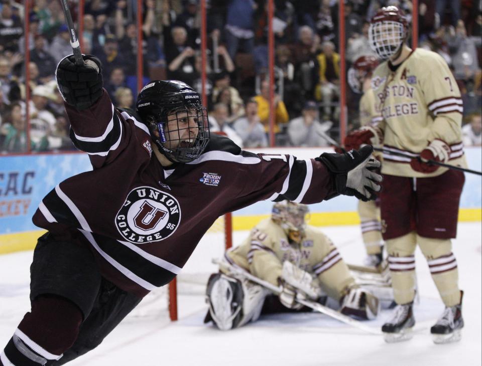 Union's Daniel Ciampini, left, reacts to his goal on Boston College's Thatcher Demko, center, with Isaac MacLeod, right, beside Demko during the second period of an NCAA men's college hockey Frozen Four tournament semfinal, Thursday, April 10, 2014, in Philadelphia. (AP Photo/Chris Szagola)