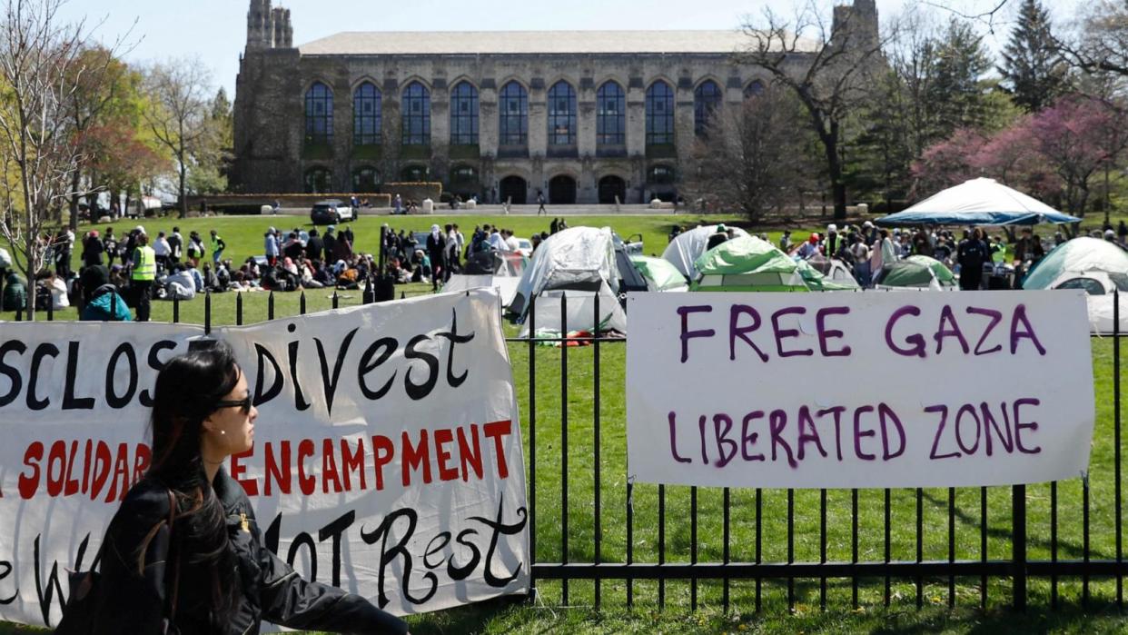 PHOTO: Signs are displayed in front of Deering Meadow, where an encampment of students are protesting in support of Palestinians, during the ongoing conflict between Israel and Hamas, at Northwestern University campus in Evanston, Ill., April 25, 2024.   (Nate Swanson/Reuters, FILE)