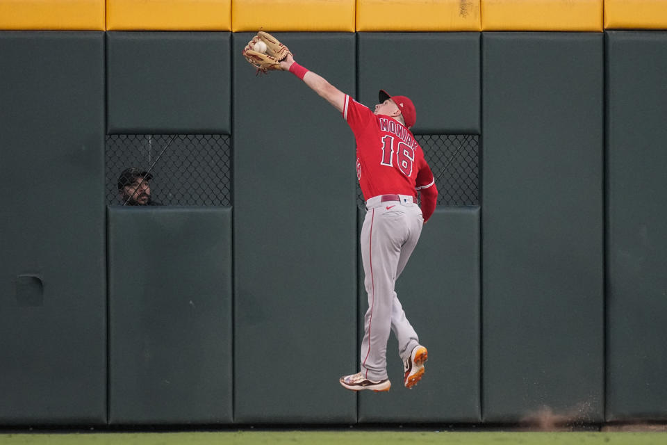 Los Angeles Angels center fielder Mickey Moniak catches a fly ball hit by Atlanta Braves' Travis d'Arnaud in the fifth inning of a baseball game Monday, July 31, 2023, in Atlanta. (AP Photo/John Bazemore)