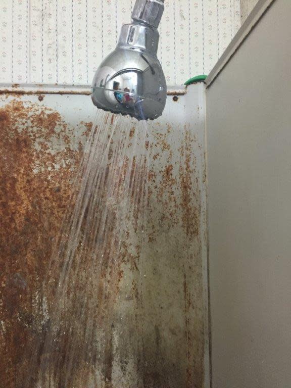 A rusty shower stall at the Cantu Detasseling Migrant Labor Camp in Onawa, Iowa, photographed during a 2017 inspection by the Iowa Department of Public Health.