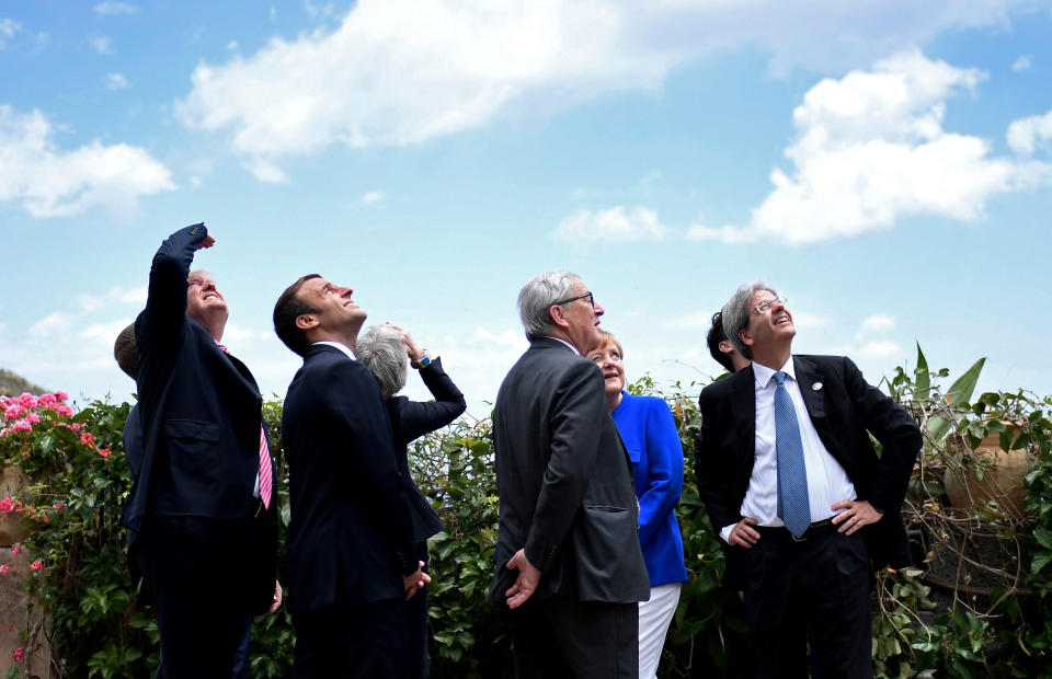 (From left to right) U.S. President Donald Trump, French President Emmanuel Macron, British Prime Minister Theresa May, European Commission&nbsp;President Jean-Claude Juncker, German Chancellor Angela Merkel and Italian Prime Minister Paolo Gentiloni watch an Italian flying squadron as part of activities at the G7 Summit in Taormina, Sicily, on May 26, 2017.