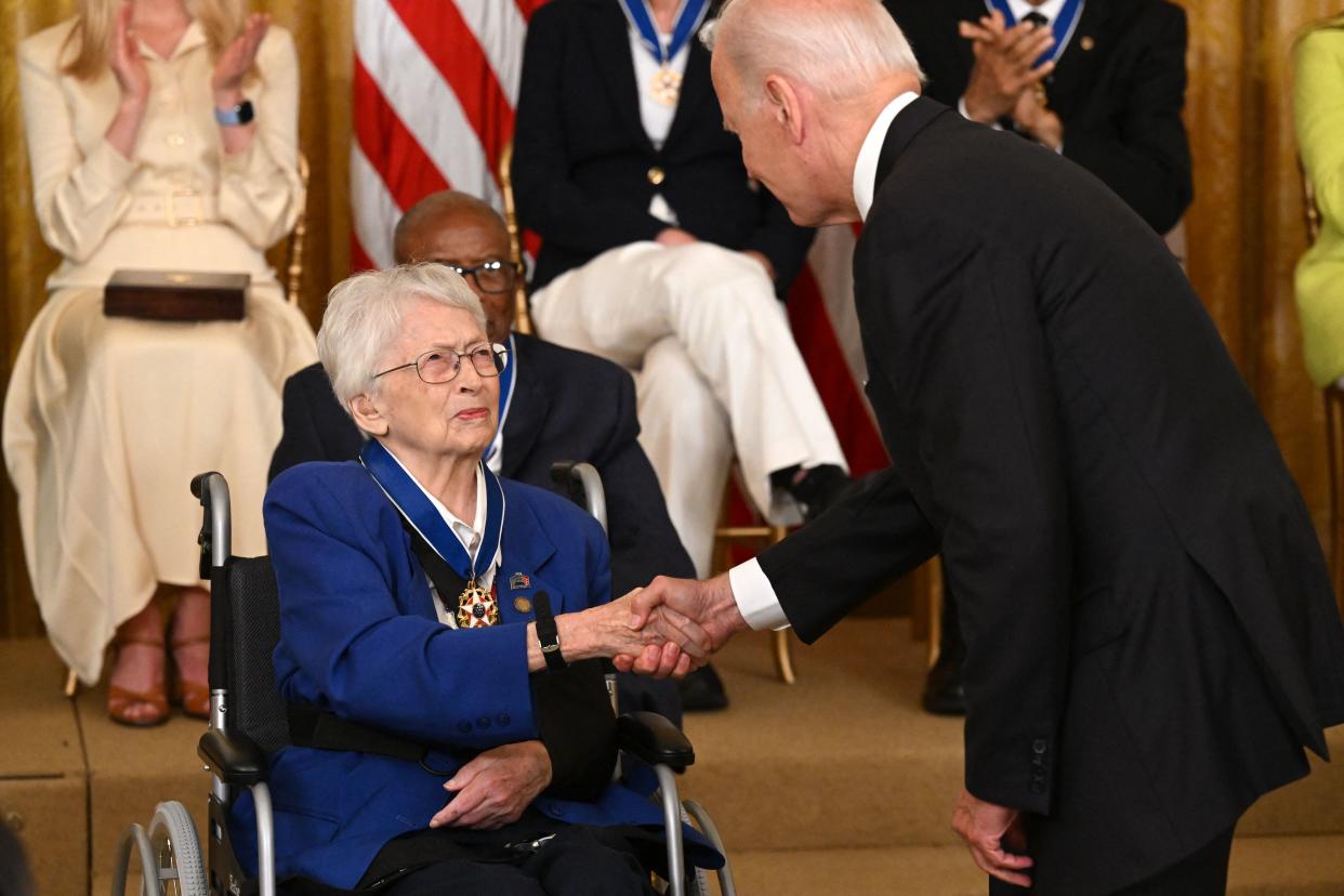 US President Joe Biden presents Brigadier General Wilma Vaught with the Presidential Medal of Freedom, the nation's highest civilian honor, during a ceremony honoring 17 recipients, in the East Room of the White House in Washington, DC, July 7, 2022. (Photo by SAUL LOEB / AFP) (Photo by SAUL LOEB/AFP via Getty Images)