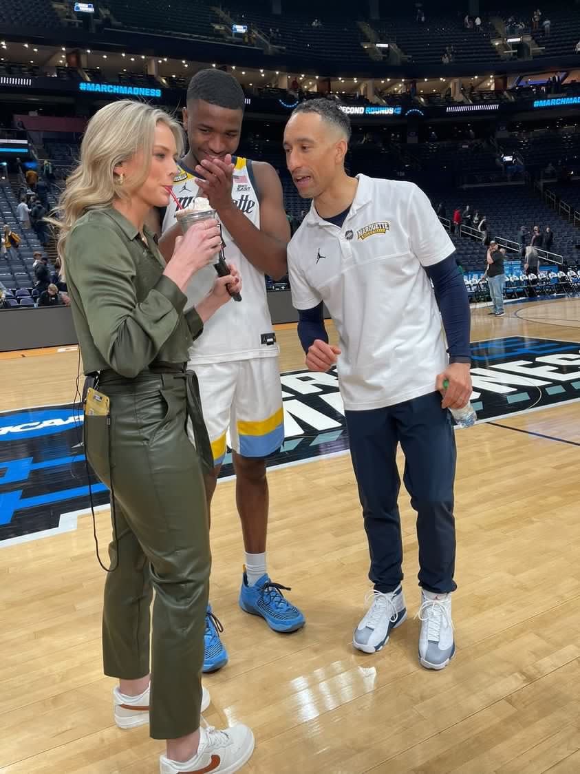 CBS Sports sideline reporter Jamie Erdahl enjoys a milkshake at the encouragement of Marquette coach Shaka Smart and point guard Kam Jones after the Golden Eagles' 78-61 win in the first round of the NCAA Tournament on Friday, March 17, 2023. Erdahl told them "it tastes like victory."