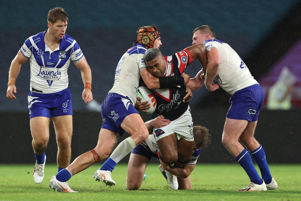 SYDNEY, AUSTRALIA - APRIL 05:  Michael Jennings of the Roosters is tackled during the round five NRL match between Canterbury Bulldogs and Sydney Roosters at Accor Stadium on April 05, 2024, in Sydney, Australia. (Photo by Cameron Spencer/Getty Images)