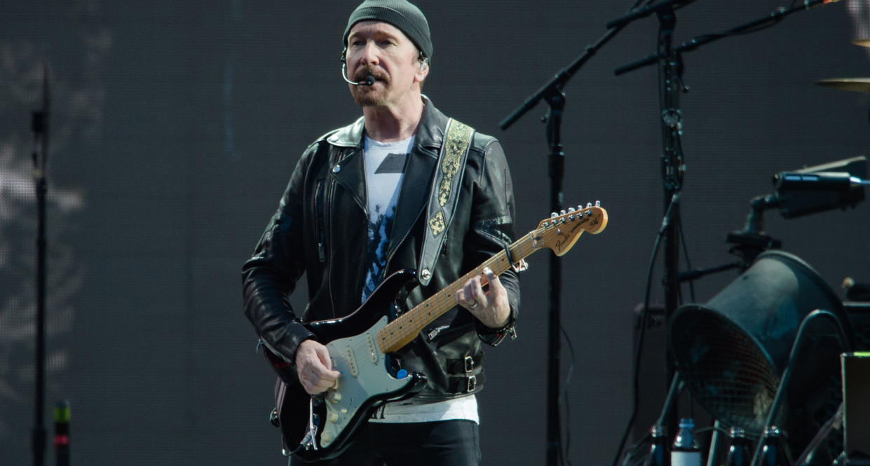  The Edge plays his 1973 Black Strat onstage. 