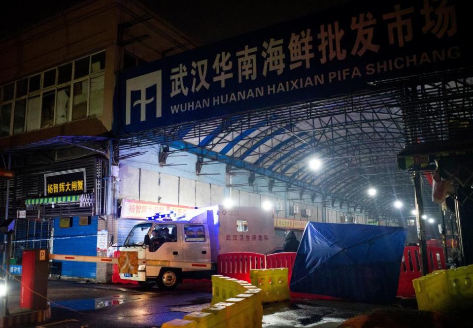 Members of staff of the Wuhan Hygiene Emergency Response Team drive their vehicle as they leave the closed Huanan Seafood Wholesale Market in the city of Wuhan, in Hubei, Province on January 11, 2020, where the Wuhan health commission said that the man who died from a respiratory illness had purchased goods. | Noel Celis–AFP/Getty