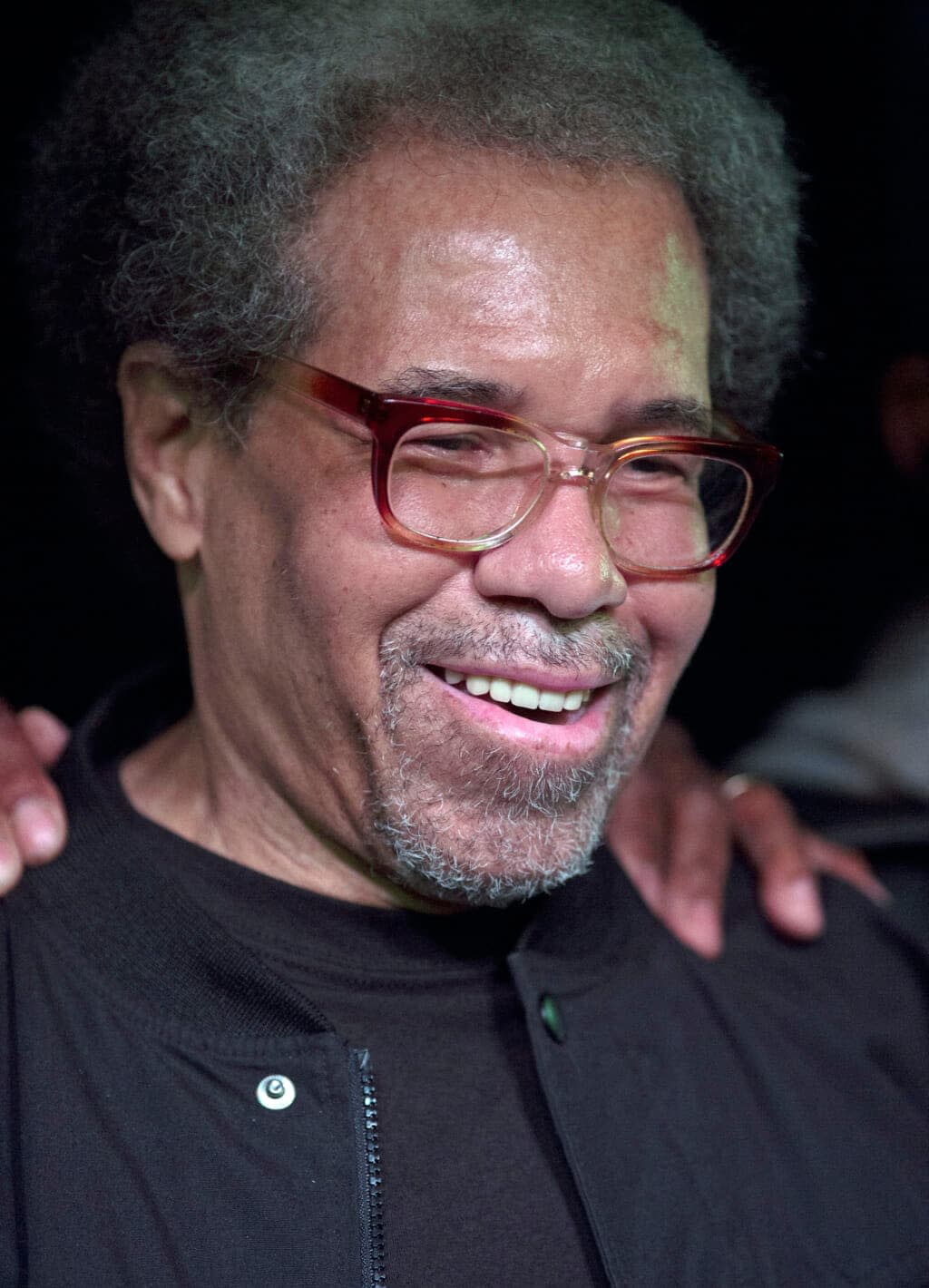 Albert Woodfox smiles as he arrives on stage during his first public appearance at the Ashe Cultural Arts Center in New Orleans, Friday, Feb. 19, 2016, after his release from Louisiana State Penitentiary in Angola, La., earlier in the day. (AP Photo/Max Becherer, File)