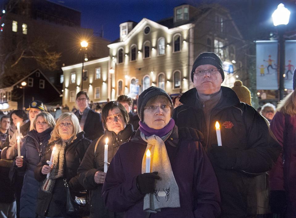<p> People attend a vigil for victims of a shooting at a mosque in Quebec City on Sunday, at the Grand Parade in Halifax on Monday, Jan. 30, 2017. Multiple people died in the attack which occurred during evening prayers. (Andrew Vaughan/The Canadian Press via AP) </p>