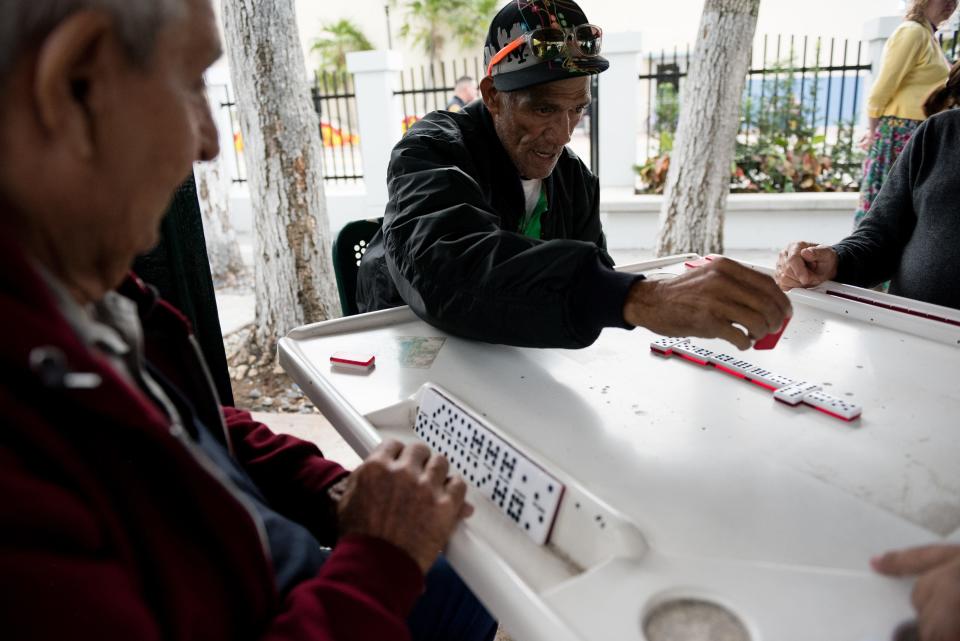 Little Havana locals play dominoes in historic Domino Park, "a great gathering place for older Cubans," a Miami historian says.