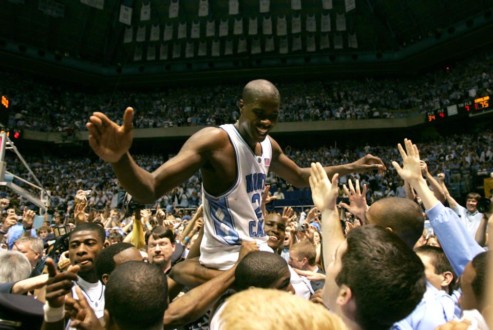 North Carolina’s Marvin Williams celebrates on the floor of the Dean Smith Center after the Tarheels defeated Duke 75-73 in Chapel Hill, N.C. Sunday, March 6, 2005. Williams scored the winning basket. (AP Photo/Gerry Broome) ORG XMIT: NCGB104