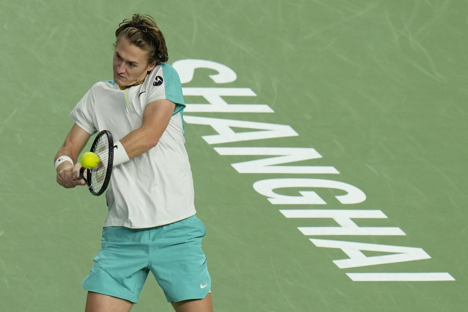 Sebastian Korda of the United States returns a shot to his compatriot Ben Shelton during the men's singles quarterfinal match in the Shanghai Masters tennis tournament at Qizhong Forest Sports City Tennis Center in Shanghai, China, Thursday, Oct. 12, 2023. (AP Photo/Andy Wong)