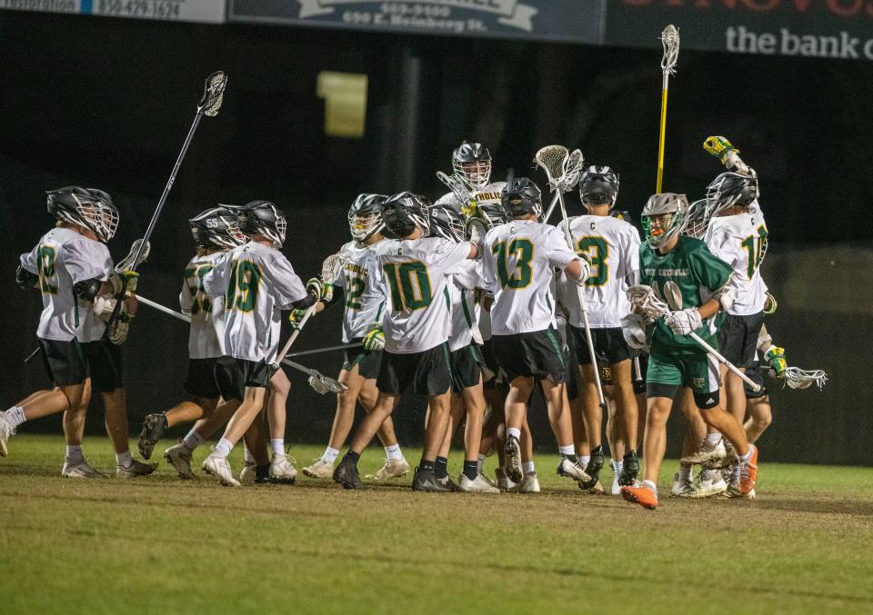 Pensacola Catholic Lacrosse team celebrates after beating Trinity Catholic 12-8 in the Region 1-1A quarterfinal Saturday, April 22, 2023 at Catholic High School.