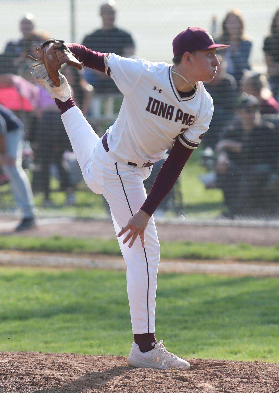 Iona's Sebastian Santos-Olson (25) pitching against Stepinac during baseball action at Iona Prep in New Rochelle April 20, 2023. Iona won the game.