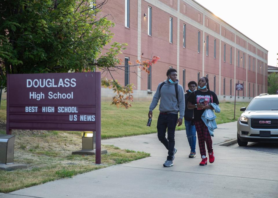 Douglass High School students return for their first day of class in Memphis, Tenn., on Aug. 9.