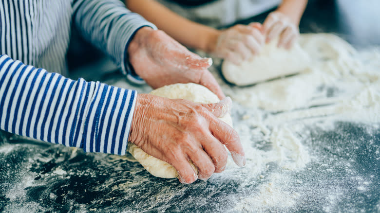 bakers kneading dough