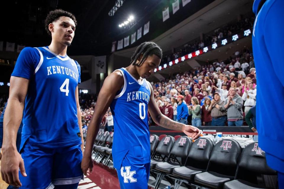 Kentucky’s Tre Mitchell (4) and Rob Dillingham (0) leave the court after the Wildcats’ overtime loss to Texas A&M.