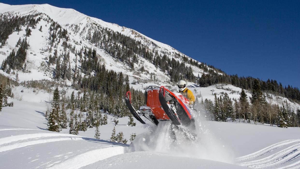  Snowmobiling in the mountains. 