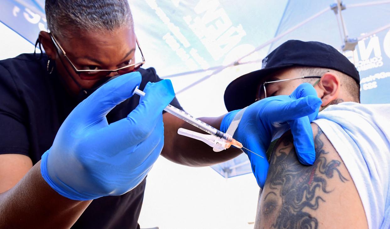 A nurse administers the Pfizer COVID-19 vaccine at a mobile clinic, July 16, 2021 in Los Angeles.