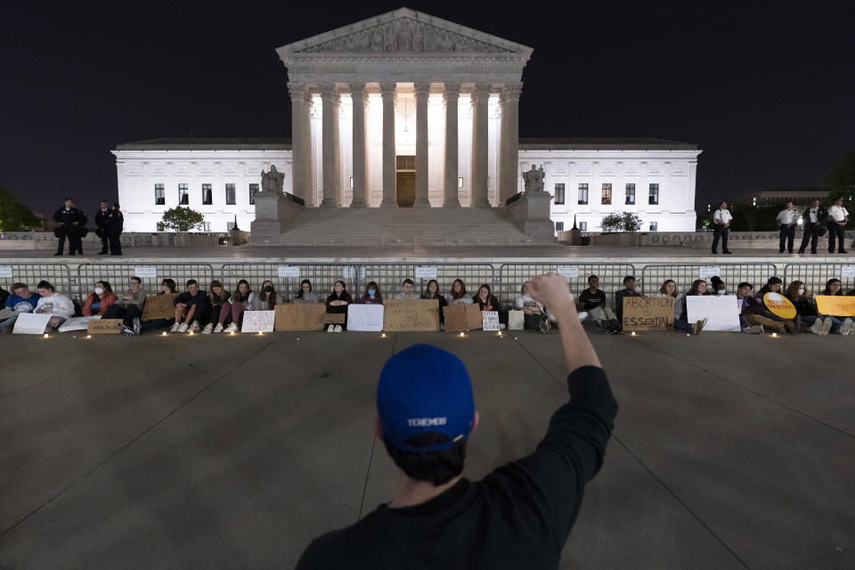 A crowd of people gather outside the Supreme Court early Tuesday, May 3, 2022, in Washington. A draft opinion suggests the U.S. Supreme Court could be poised to overturn the landmark 1973 Roe v. Wade case that legalized abortion nationwide, according to a Politico report released Monday. Whatever the outcome, the Politico report represents an extremely rare breach of the court's secretive deliberation process, and on a case of surpassing importance. (AP Photo/Alex Brandon)