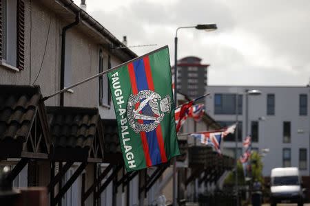 A Royal Irish Regiment Flag (RIR) flies in the Loyalist lower Shankill estate in West Belfast August 19, 2014. REUTERS/Cathal McNaughton