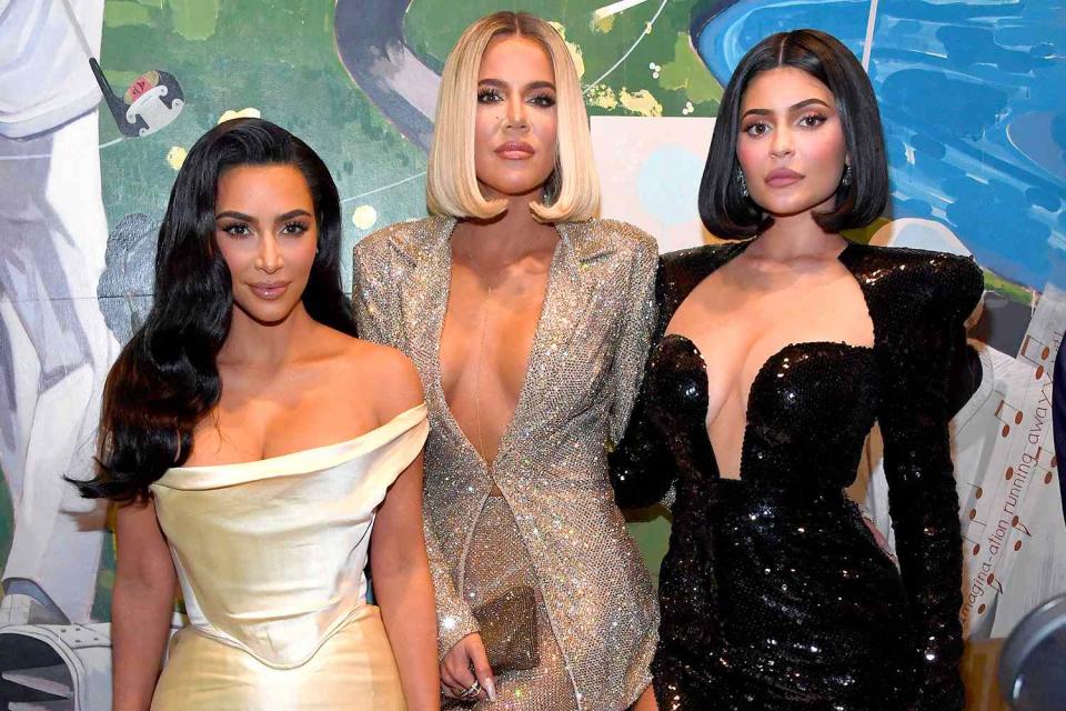 <p>Kevin Mazur/Getty Images</p> Kim Kardashian, Khloé Kardashian and Kylie Jenner 