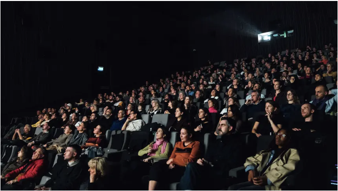 IDFA audiences watch a film