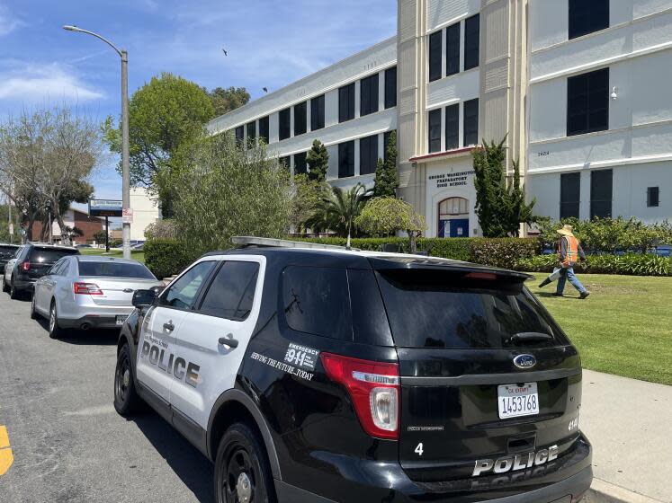 School police parked in front of Washington Preparatory High School in South L.A. and increased neighborhood patrols after one student fatally shot another after school on April 15 outside a nearby convenience store.