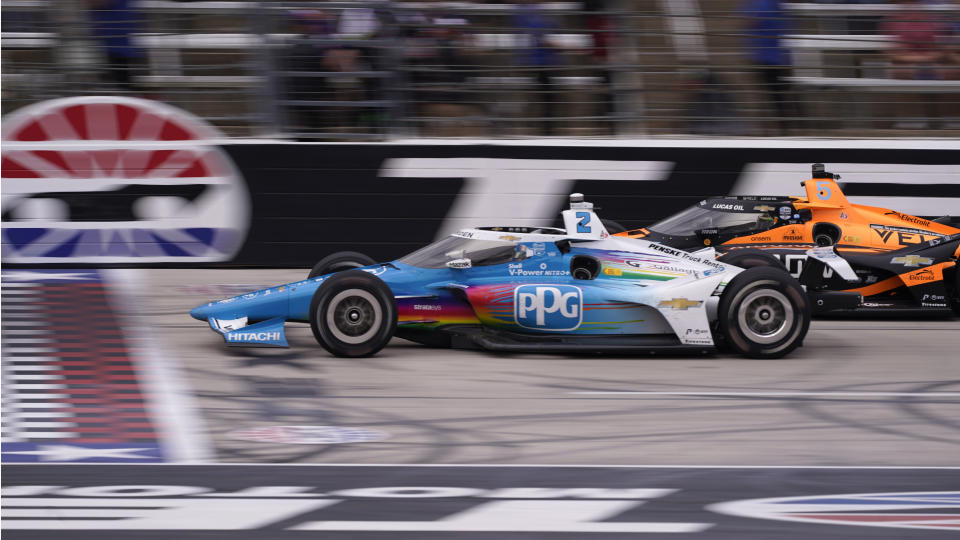 Josef Newgarden (2) and Pato O'Ward (5) of Mexico race in late laps during the IndyCar auto race at Texas Motor Speedway in Fort Worth, Texas, Sunday, April 2, 2023. Newgarden won the race. (AP Photo/LM Otero)