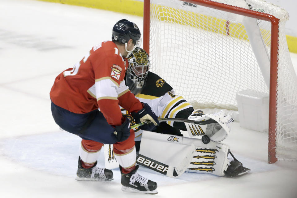 Florida Panthers center Aleksander Barkov (16) attempts a shot at Boston Bruins goaltender Jaroslav Halak (41) during an overtime period of an NHL hockey game, Thursday, March 5, 2020, in Sunrise, Fla. (AP Photo/Wilfredo Lee)