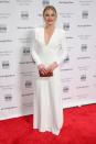 <p>Margot was a vision in white in a simple long-sleeved Calvin Klein gown. <i>[Photo: Getty]</i> </p>